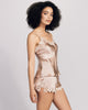 The Clara vintage rose camisole set from Emma Harris is crafted from vintage rose pink silk with matching shimmering floral lace appliqué 