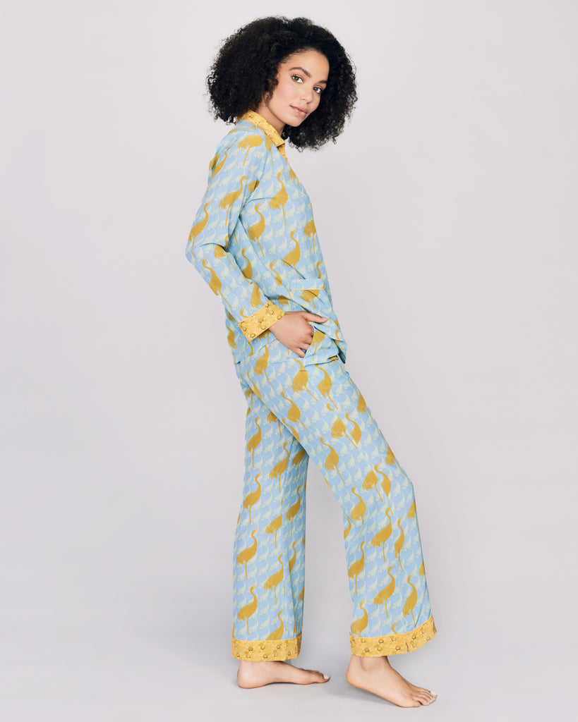 The tailored button-down top on the Tokyo Crane silk pajama from Karma on the Rocks has the contrast trim at the v neckline and narrow collar, mother of pearl buttons