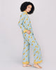 The tailored button-down top on the Tokyo Crane silk pajama from Karma on the Rocks has the contrast trim at the v neckline and narrow collar, mother of pearl buttons