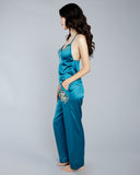 Teal Elsa pajama set from Emma Harris is crafted from stretch silk with gold Leavers lace appliqué