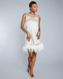The Champagne in Venice dress is sleeveless with a scoop neckline and white marabou trim at the hem