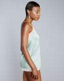 V-neck camisole from Vannina Vesperini is crafted from a dreamy seaglass blue-green silk with off white lace