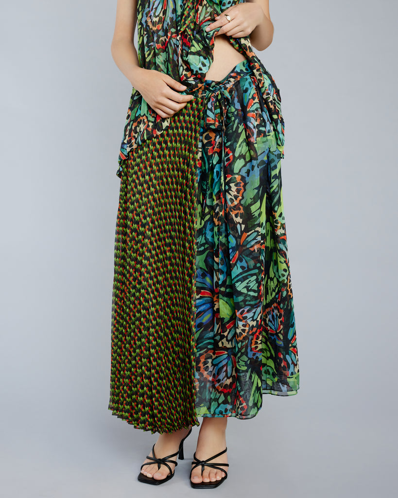 Pleated wrap skirt from Zoelle is crafted from a lightweight chiffon with intricate butterfly-inspired geometric prints in shades of green, blue, orange, black and red