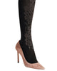 Opaque black Moon Gala tights have a 50 denier appearance and a baroque decorative pattern 3D knit into the lower leg
