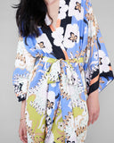 Classic St Tropez silk robe from Christine Vancouver showcases a floral pattern in shades of black, white, tan, chartreuse green, sky blue and coral