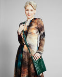 Cross-body purse from Elisabeth Weinstock is crafted from emerald green glazed snakeskin 