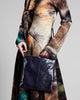 Cross-body purse from Elisabeth Weinstock is crafted from navy blue glazed snakeskin 