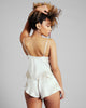 Emma Harris's Celeste tap pant is flirty and comfortable, with an elasticized waist and lace appliqué at the sides