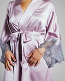 Rochelle robe from Emma Harris is crafted from pale orchid purple stretch silk with shimmering smoky lavender lace