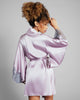 Vented kimono sleeves on the Rochelle robe from Emma Harris feature a wide swath of shimmering lace appliqué at the cuffs