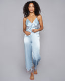 Veronique silk camisole and lounge pant set from Emma Harris is crafted from a pale blue silk with shimmering metallic purple lace appliqué 