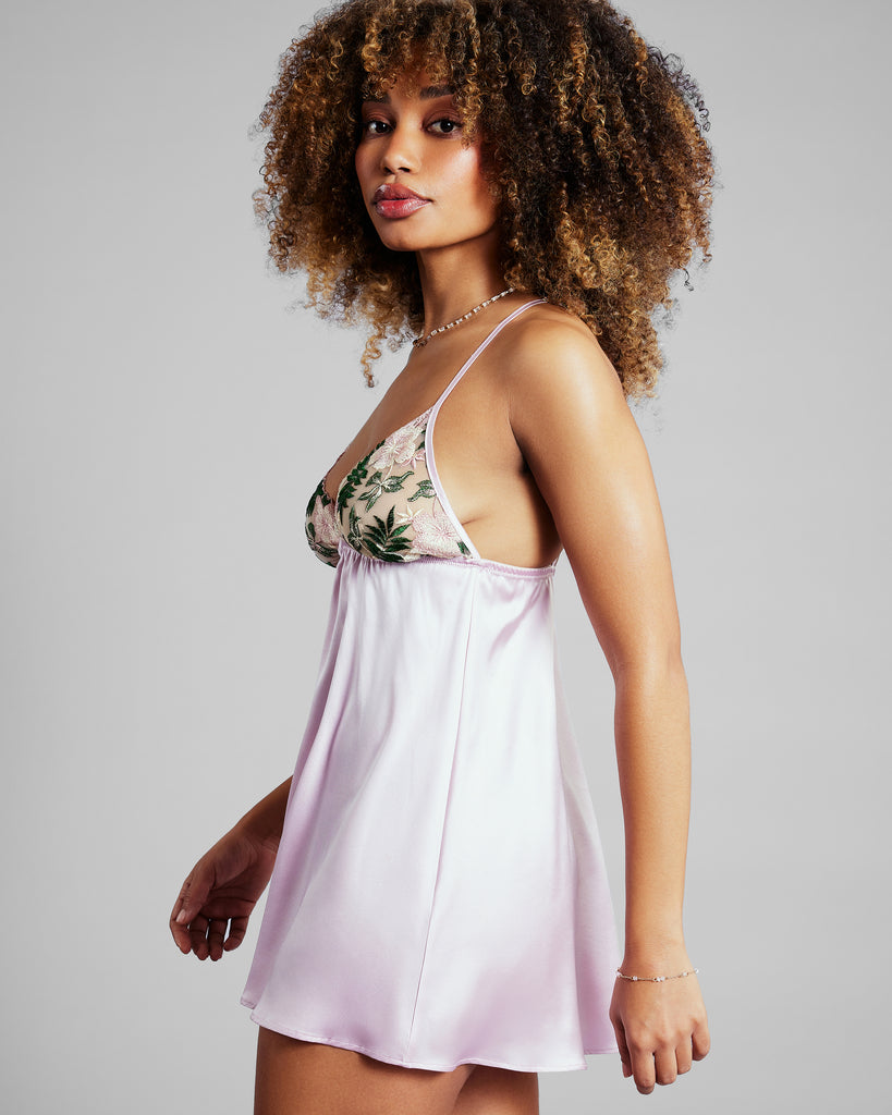 Babydoll chemise from Gilda & Pearl is crafted from pale pink silk and soft stretch tulle embroidered with pink flowers and leaves