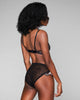 Matching Selene high-waisted panty by Karolina Laskowska hits around the natural waist on most, entirely crafted of “circuit board” sheer lace with sequin trim at the high-cut legs, a functional Swarovski crystal button at the hip, and a silk-lined gusset