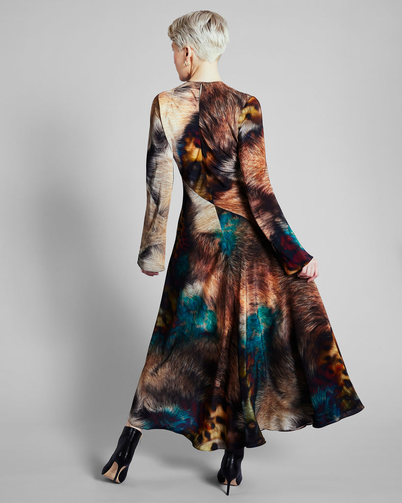 Long-sleeved Reindeer Zennor dress is crafted from silk with a photorealistic fur print with bright color accents in teal, orange, yellow and red