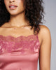 Camisole  from Merle Noir is crafted from luxurious pink silk with a painstaking appliqué of pink floral lace at the neckline and hem