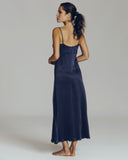 Navy blue gown from Morpho + Luna is constructed of an indulgent sueded silk