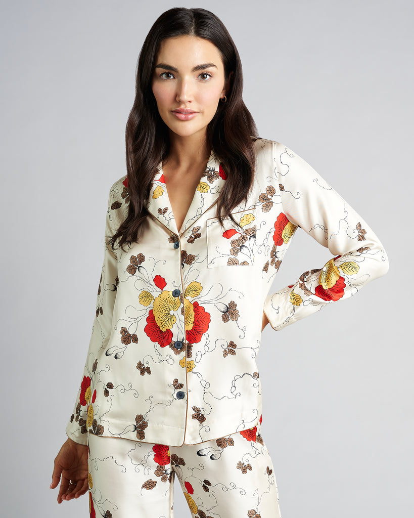 Silk pajama from Morpho + Luna is crafted from an ivory silk twill with a print in shades of red, bronze, brown and black